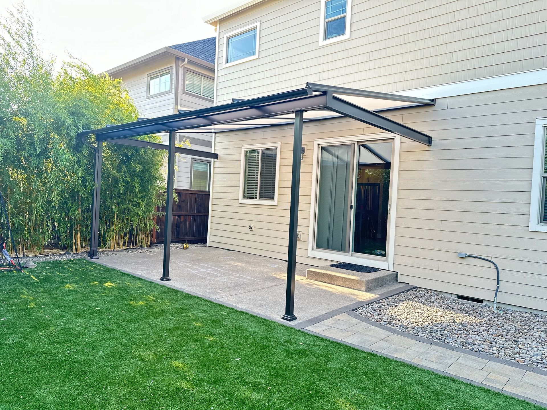 Wilsonville Patio Cover by Crown Patio Covers - Shed style frame with Acrylite acrylic cover allowing daylight through