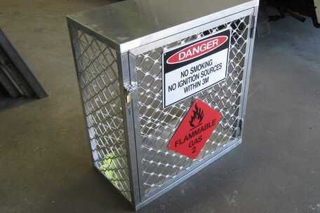 A metal box with a danger sign on it.