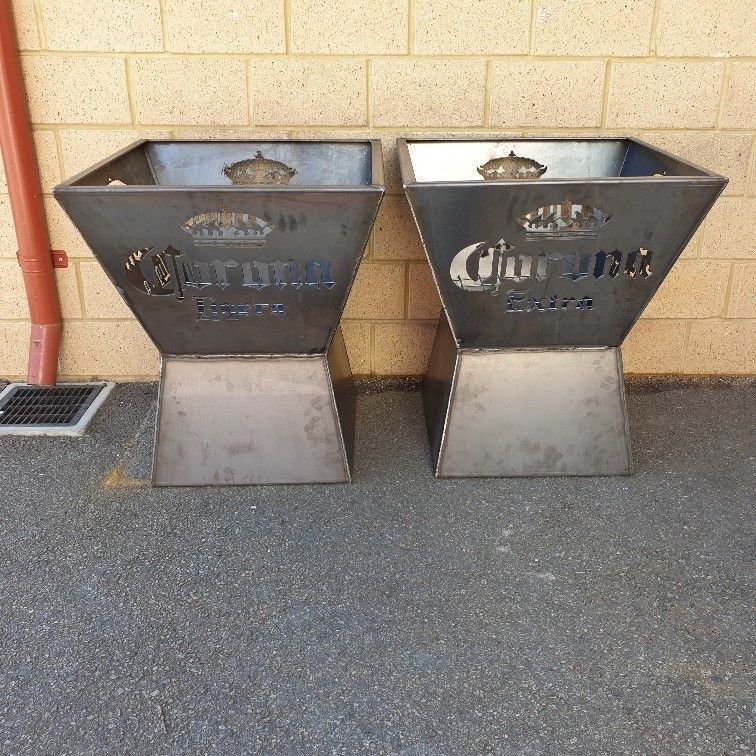 Two metal planters with corona written on them