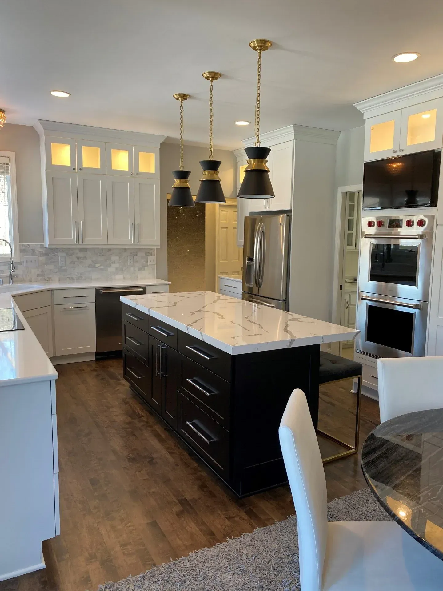 A kitchen with a large island in the middle of it.