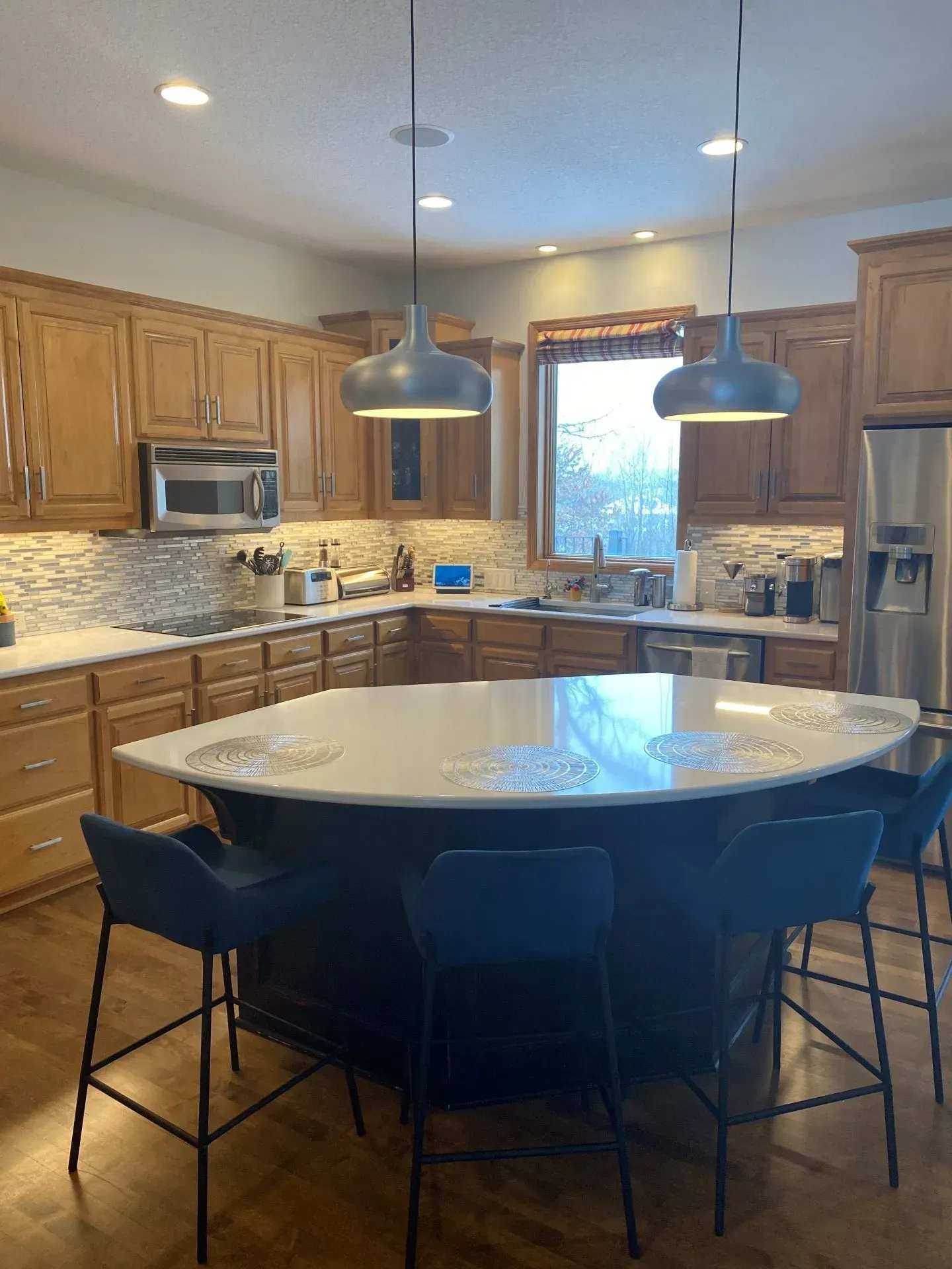 There is a large island in the middle of the kitchen.