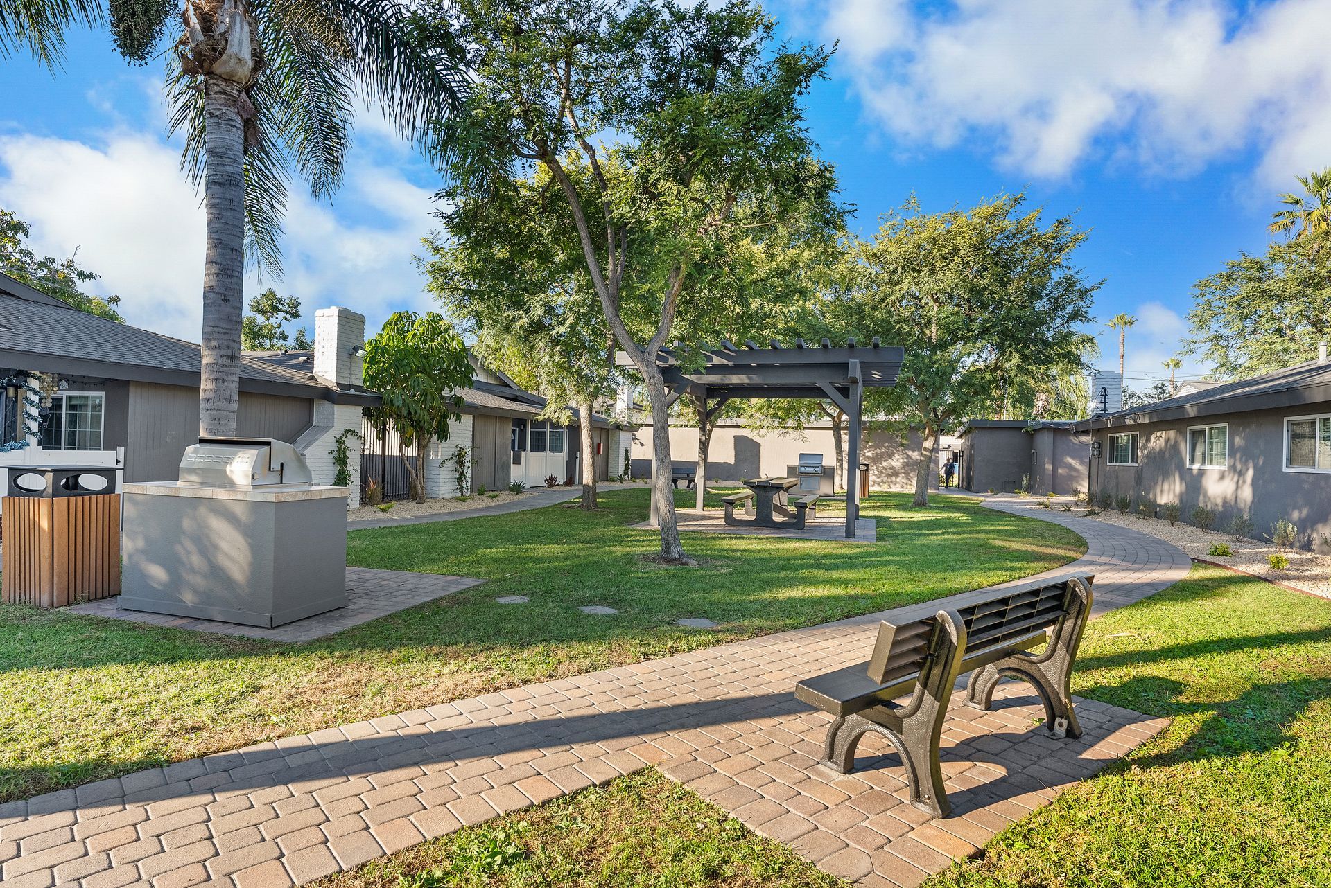 Exterior Photo of Property - bench and bbq grill