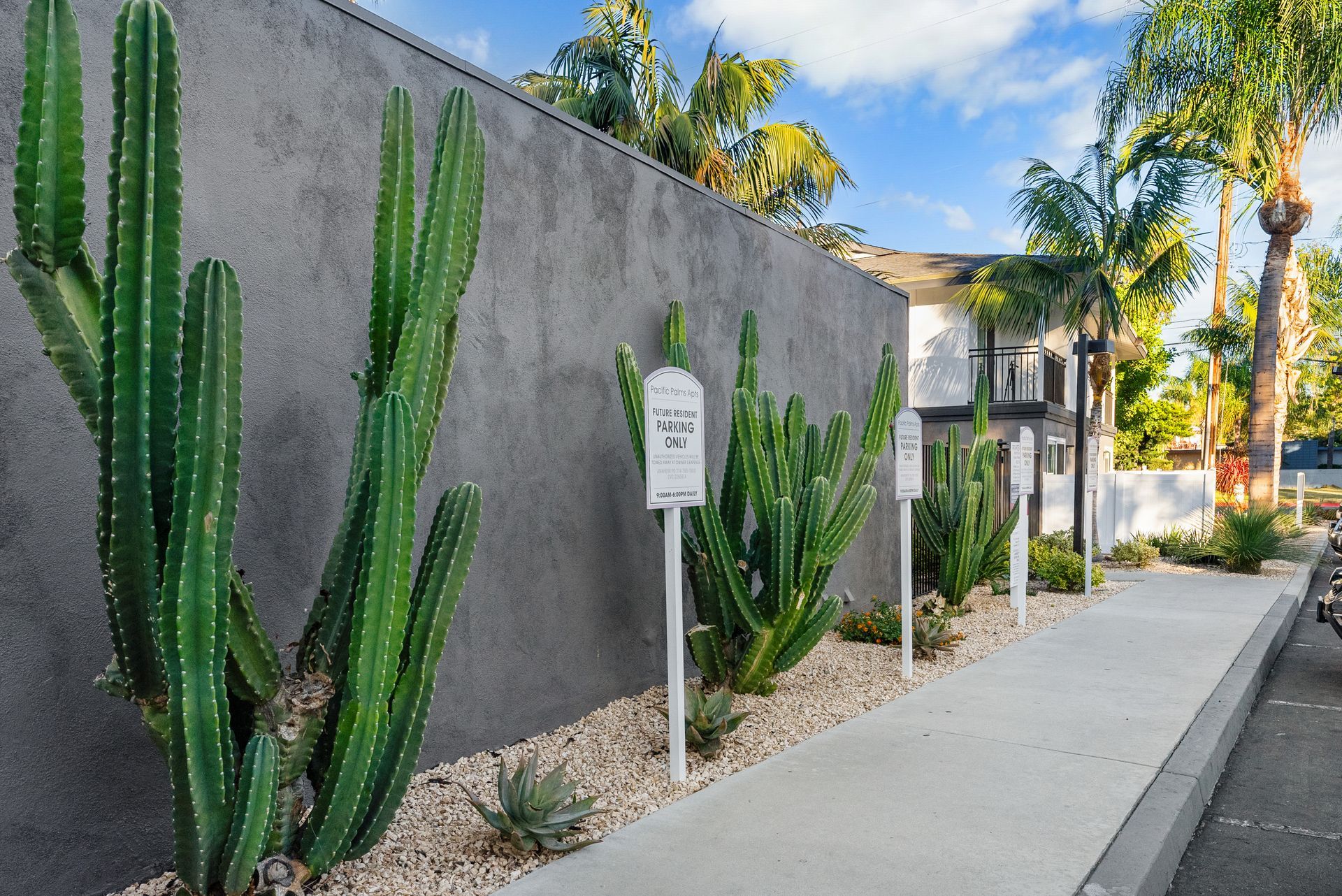 Exterior Photo of Property - cacti and reserved parking