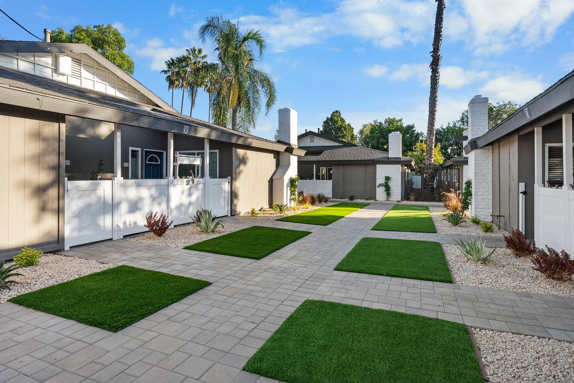 Exterior Photo of Property - exterior buildings, grass, and concrete