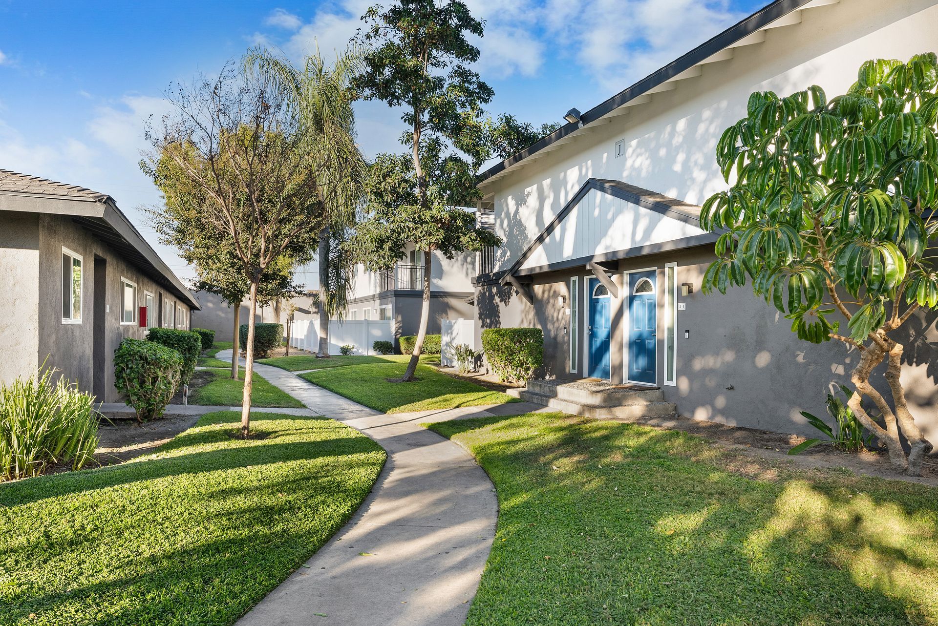 Exterior Photo of Property - winding path to trees and front door