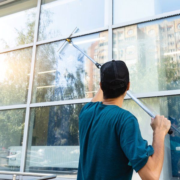 Professional Worker Cleaning Windows