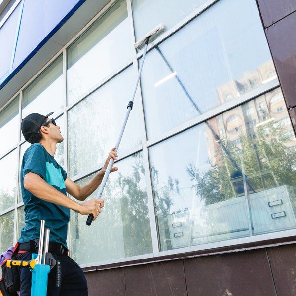 Worker Doing Commercial Window Cleaning
