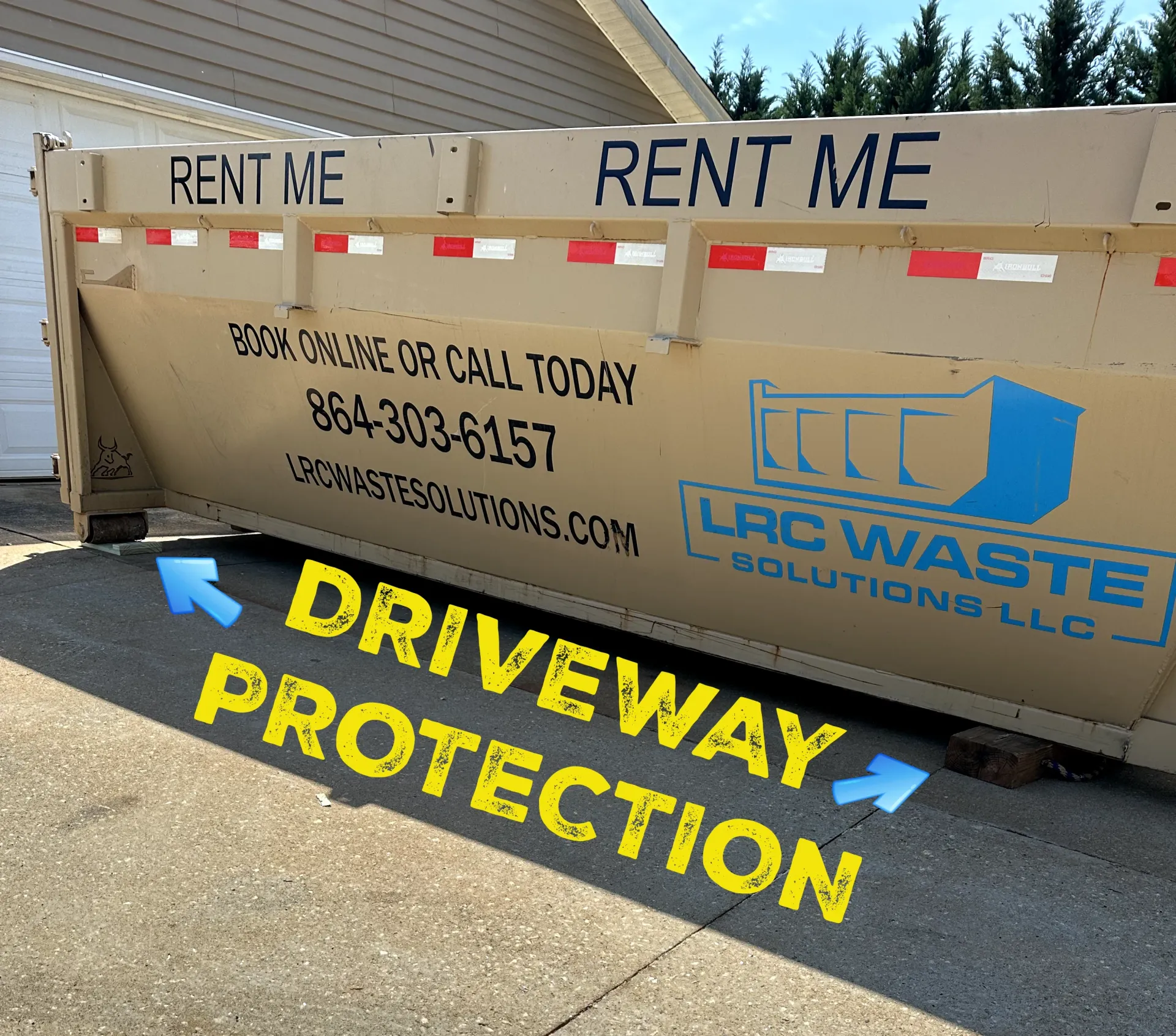 A dumpster that says rent me driveway protection