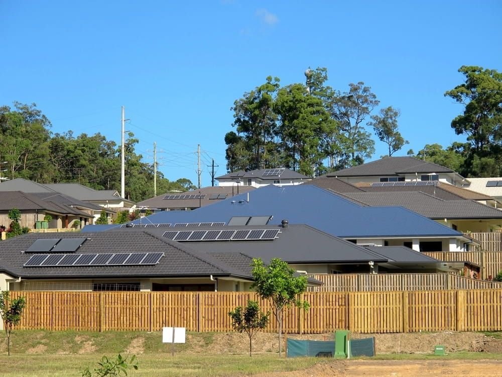 A Row Of Houses With Solar Panels On The Roofs — Mackies In Port Macquarie, NSW