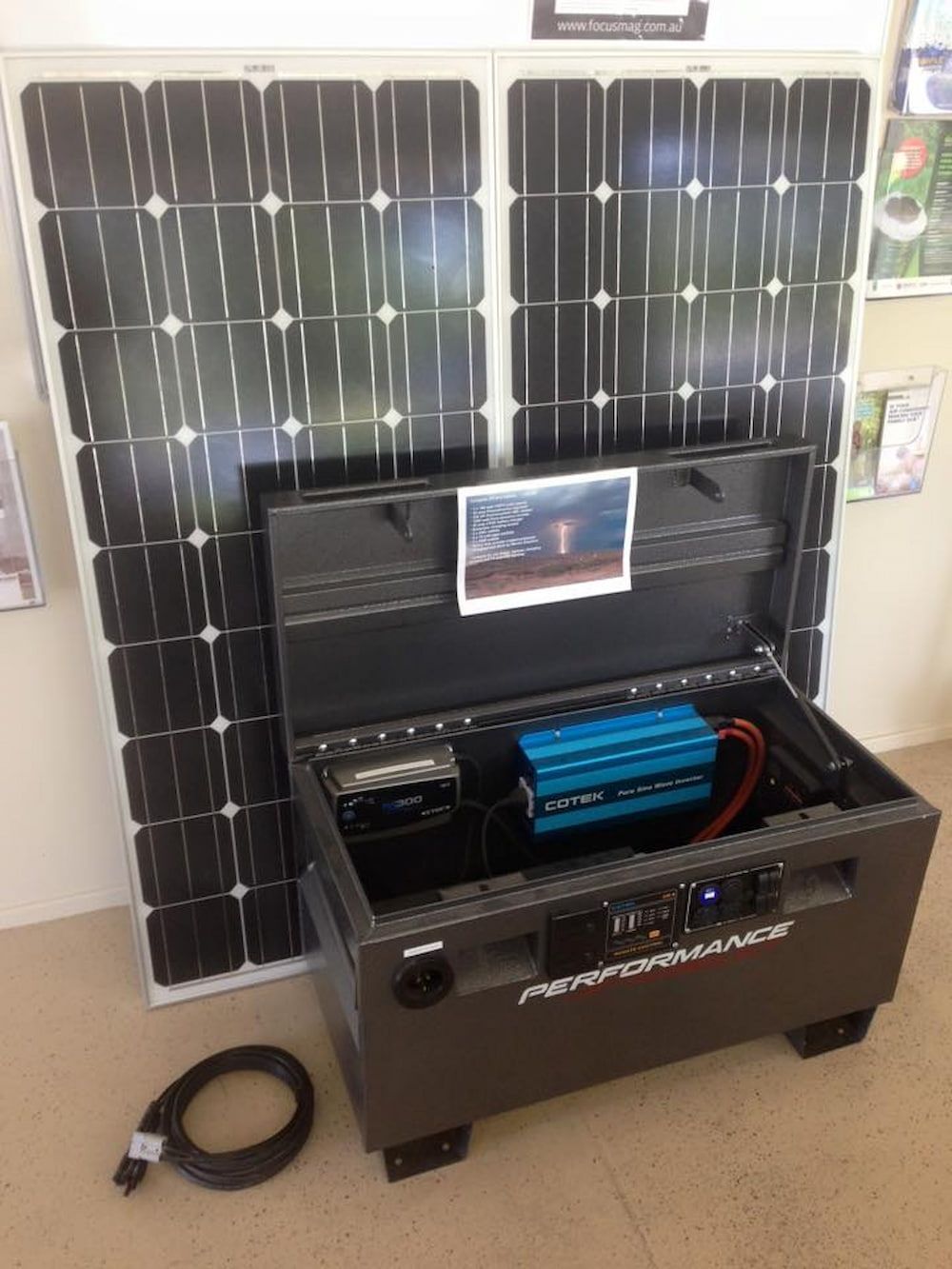 A Solar Panel Is Sitting On Top Of A Table Next To A Box — Mackies In Taree, NSW