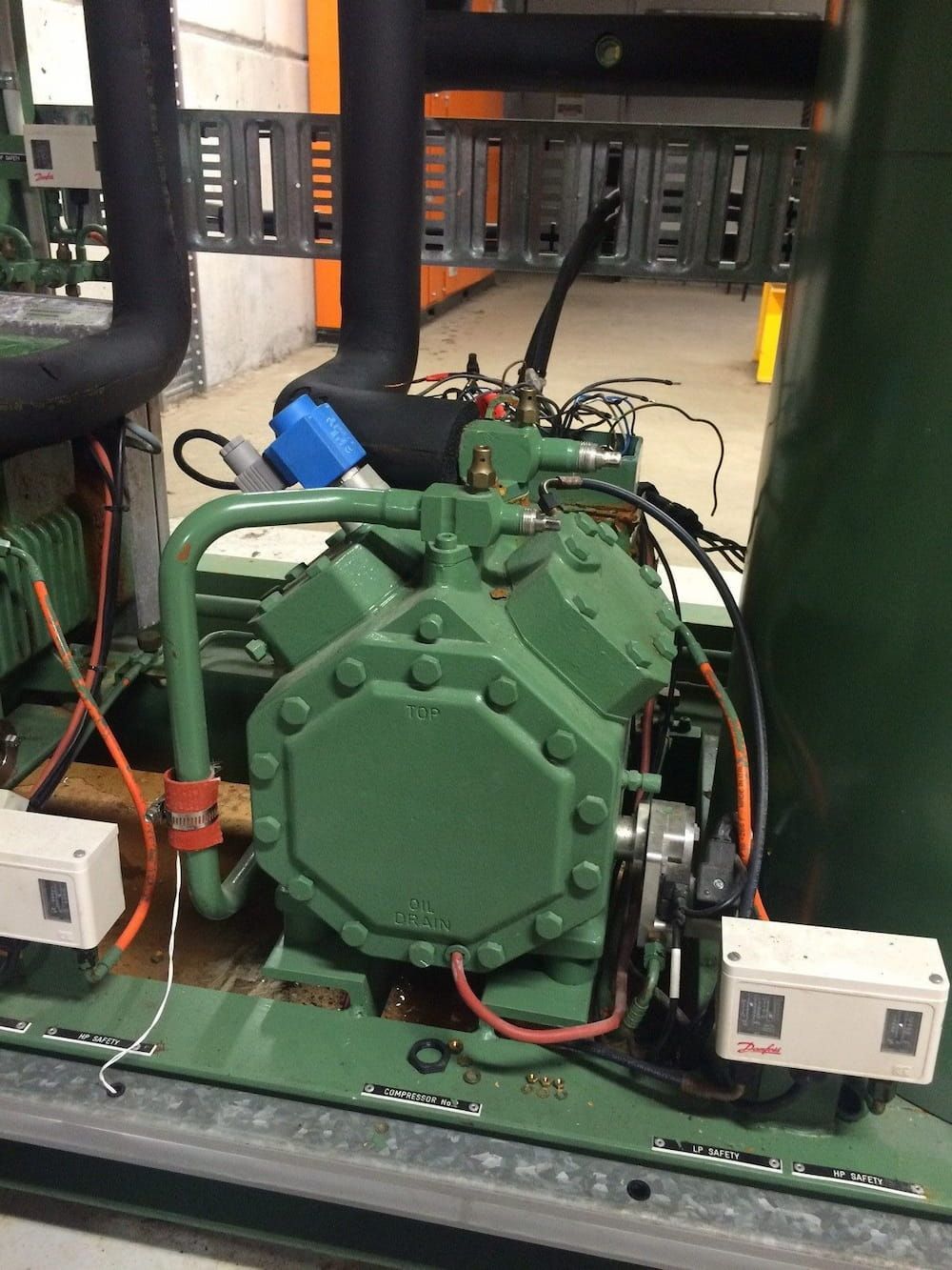 Green Industrial Refrigeration Compressor With Black Pipes — Mackies in Taree, NSW