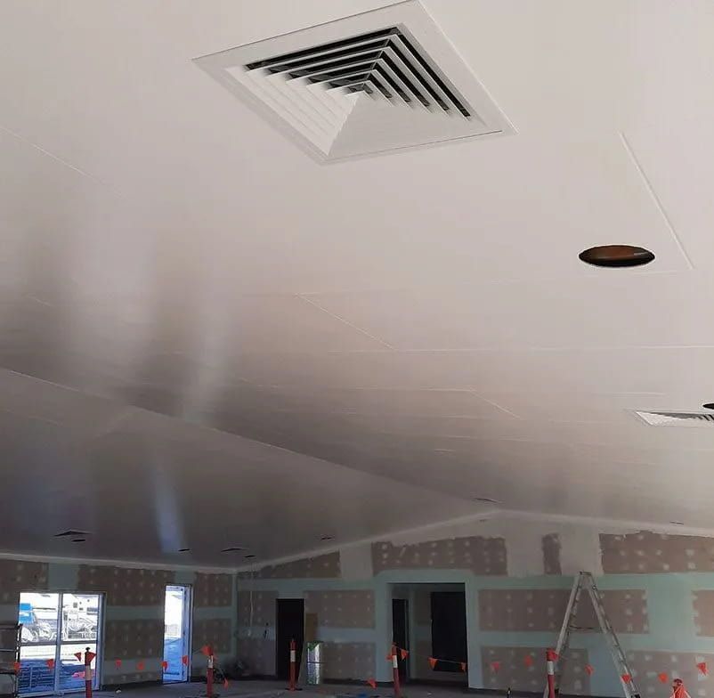 A Large Room With A White Ceiling And A Ceiling Fan — Mackies In Port Macquarie, NSW