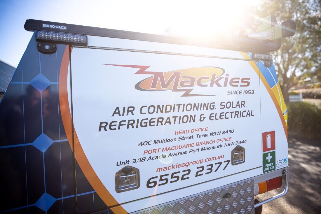 Back Of A White Service Vehicle With The Mackie's Logo  — Mackies In Coffs Harbour, NSW