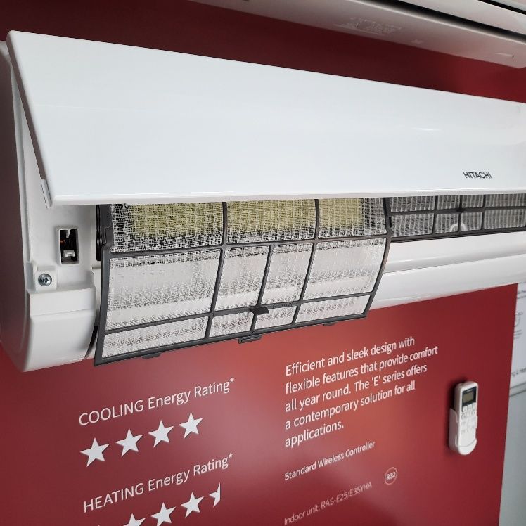 Close-up Of A White Hitachi Air Conditioner With Its Filter Exposed — Mackies In Coffs Harbour, NSW