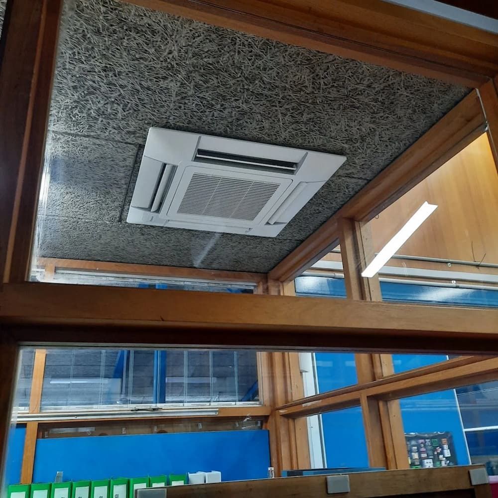 A Room With A Ceiling Mounted Air Conditioner — Mackies In Taree, NSW