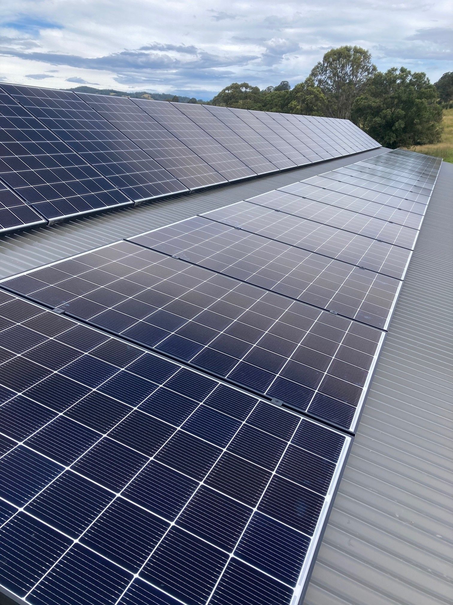 Solar Panels Installed On A Grey Metal Roof — Mackies In Taree, NSW