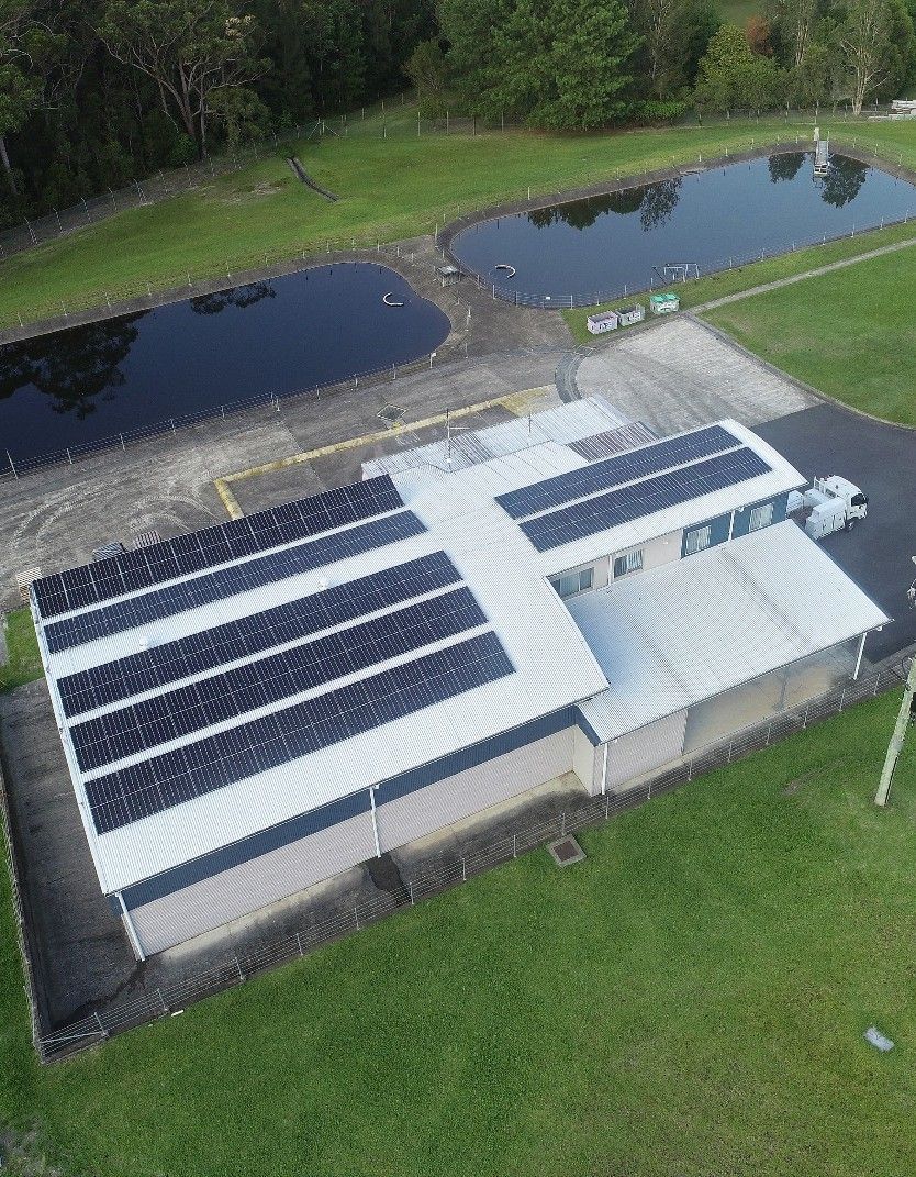 An Aerial View Shows A Building With Solar Panels — Mackies in Taree, NSW
