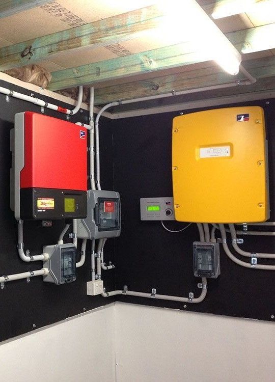 Red And Yellow Solar Inverters And Electrical Boxes — Mackies in Taree, NSW