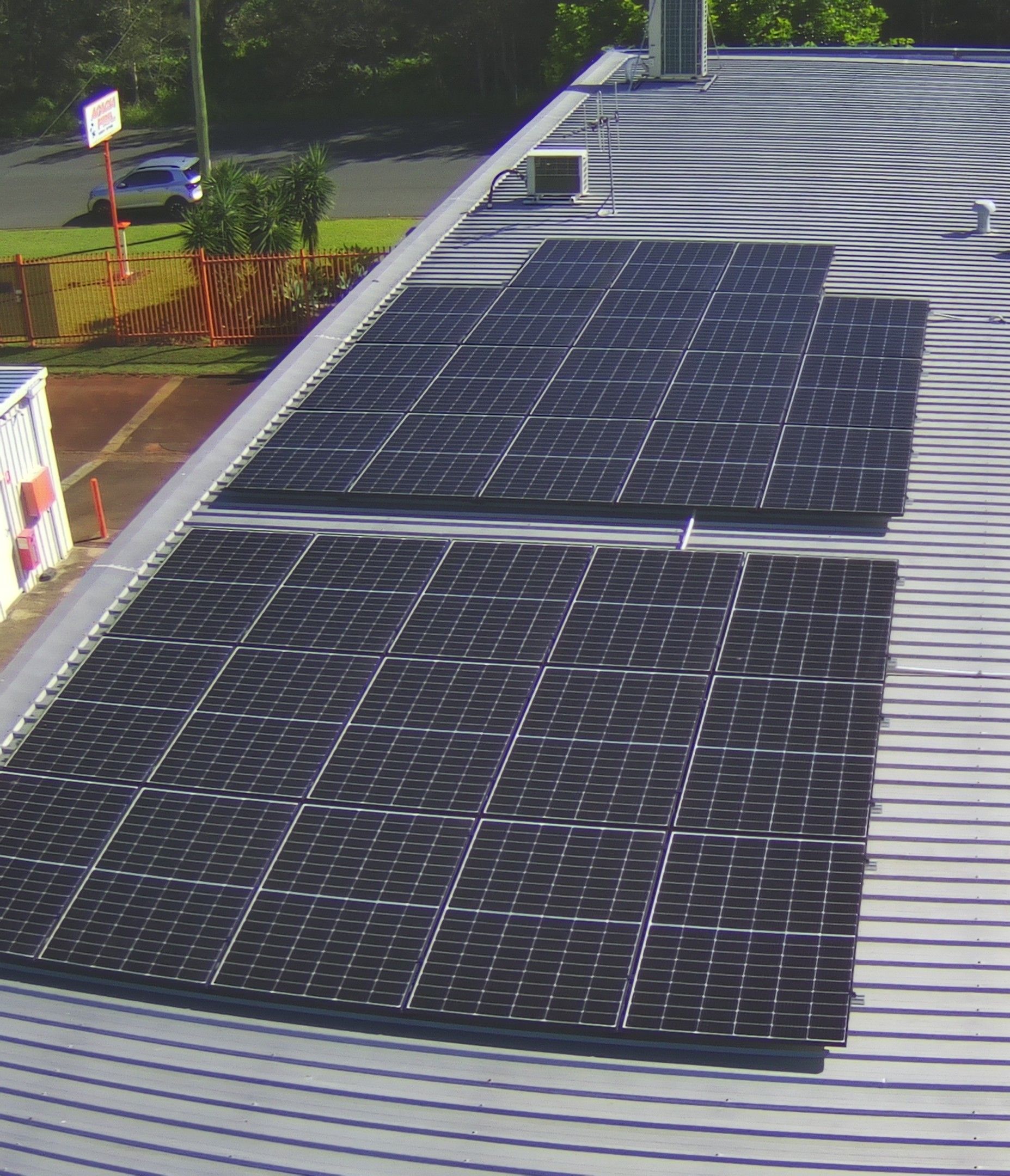 Solar Panels Installed On A Corrugated Metal Roof — Mackies in Taree, NSW