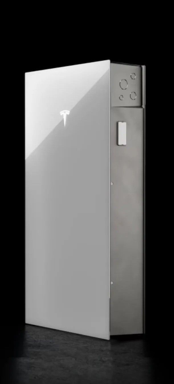 Tesla Powerwall Battery Against A Black Background — Mackies in Taree, NSW