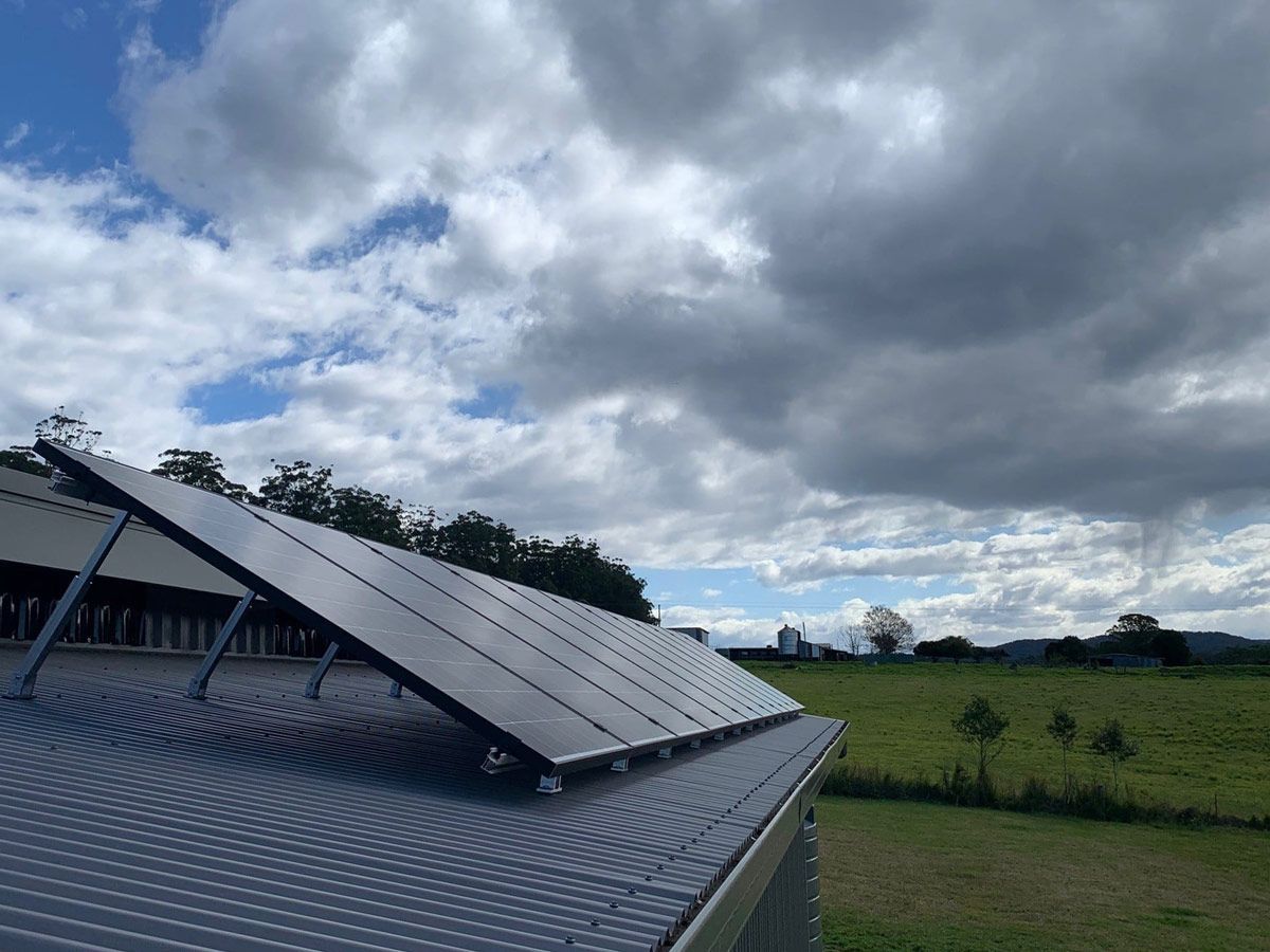 Solar Panels On A Rooftop, Angled Towards The Sky — Mackies in Taree, NSW