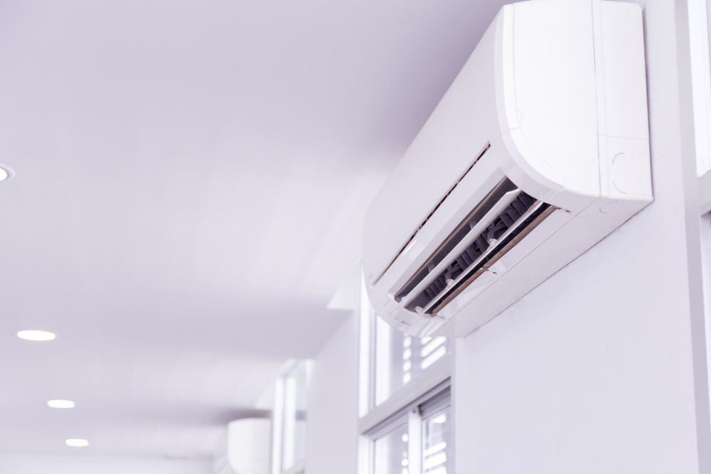 Split Type Air Conditioner in An Empty White Room
