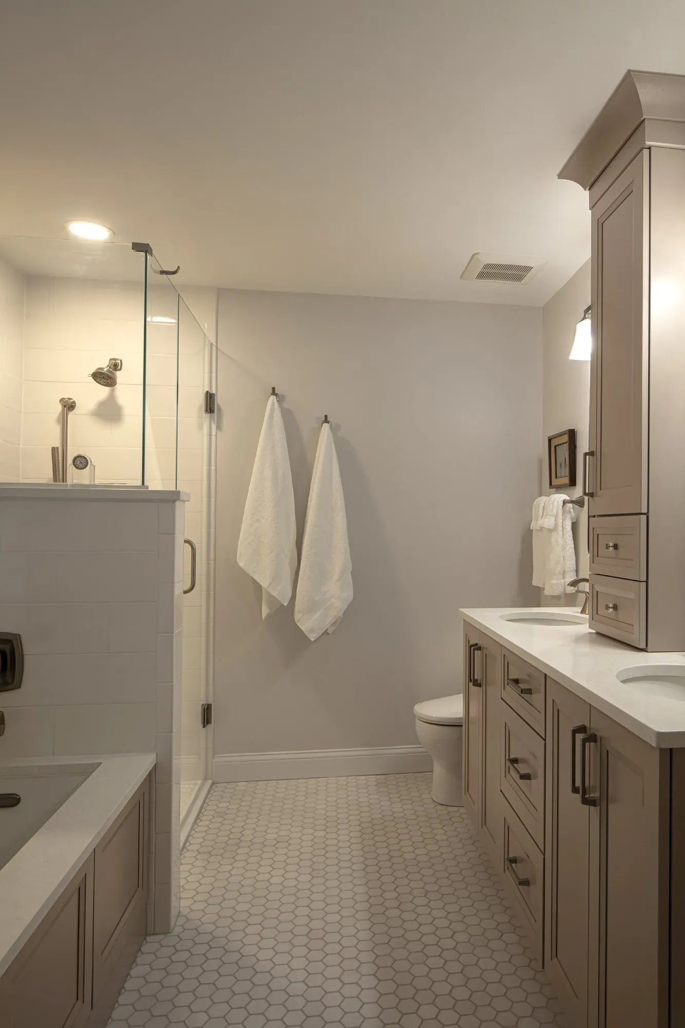 Bathroom with towels and frame | St. Louis, MO | Perspective Cabinetry & Design