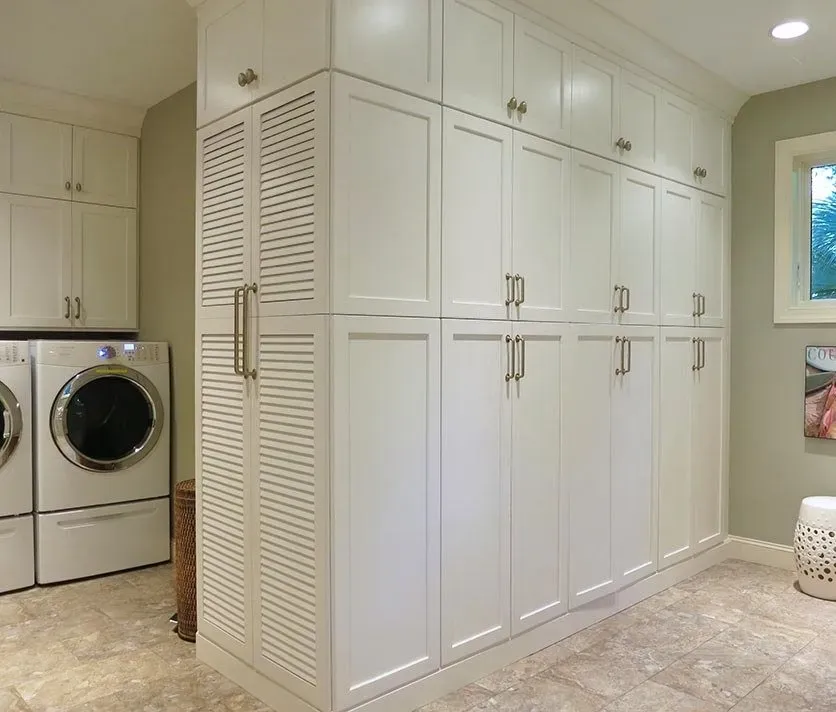 White closet in laundry area | St. Louis, MO | Perspective Cabinetry & Design