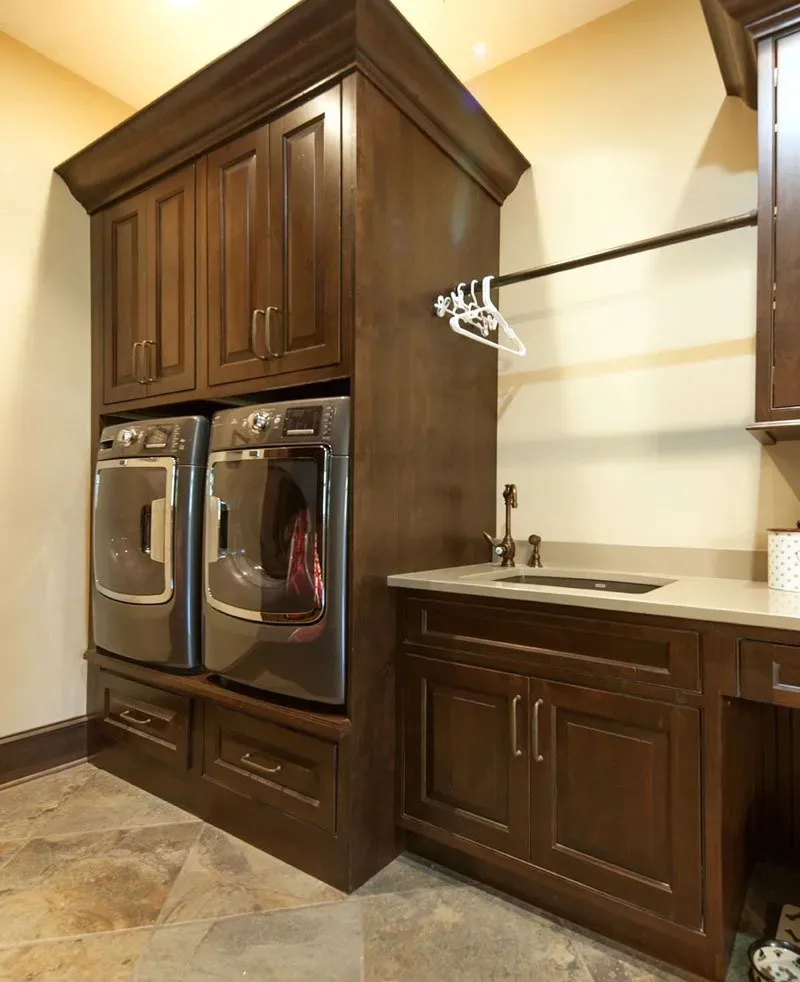 Laundry area with hanger | St. Louis, MO | Perspective Cabinetry & Design
