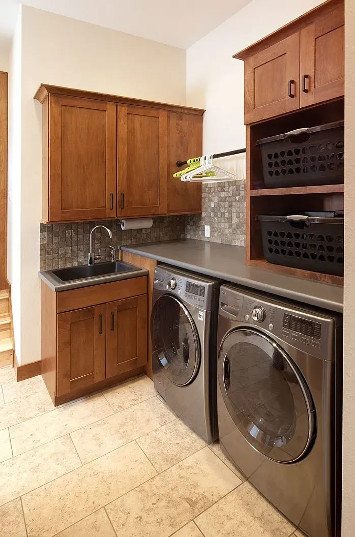 Laundry area near a sink | St. Louis, MO | Perspective Cabinetry & Design