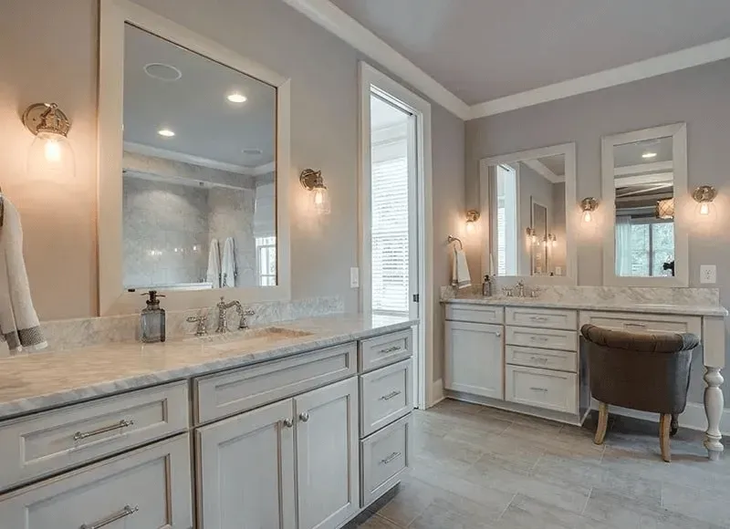 Bathroom with cozy chair | St. Louis, MO | Perspective Cabinetry & Design