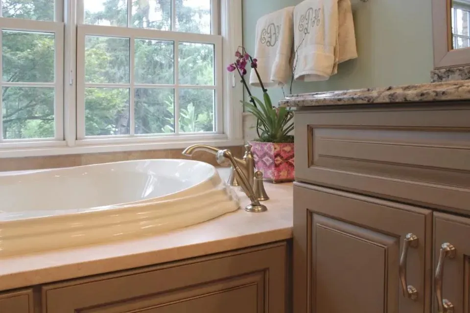 Flowers near bathtub | St. Louis, MO | Perspective Cabinetry & Design