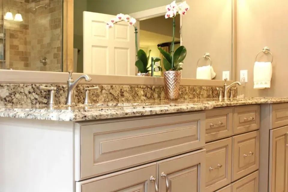 Bathroom with flowers and faucet | St. Louis, MO | Perspective Cabinetry & Design