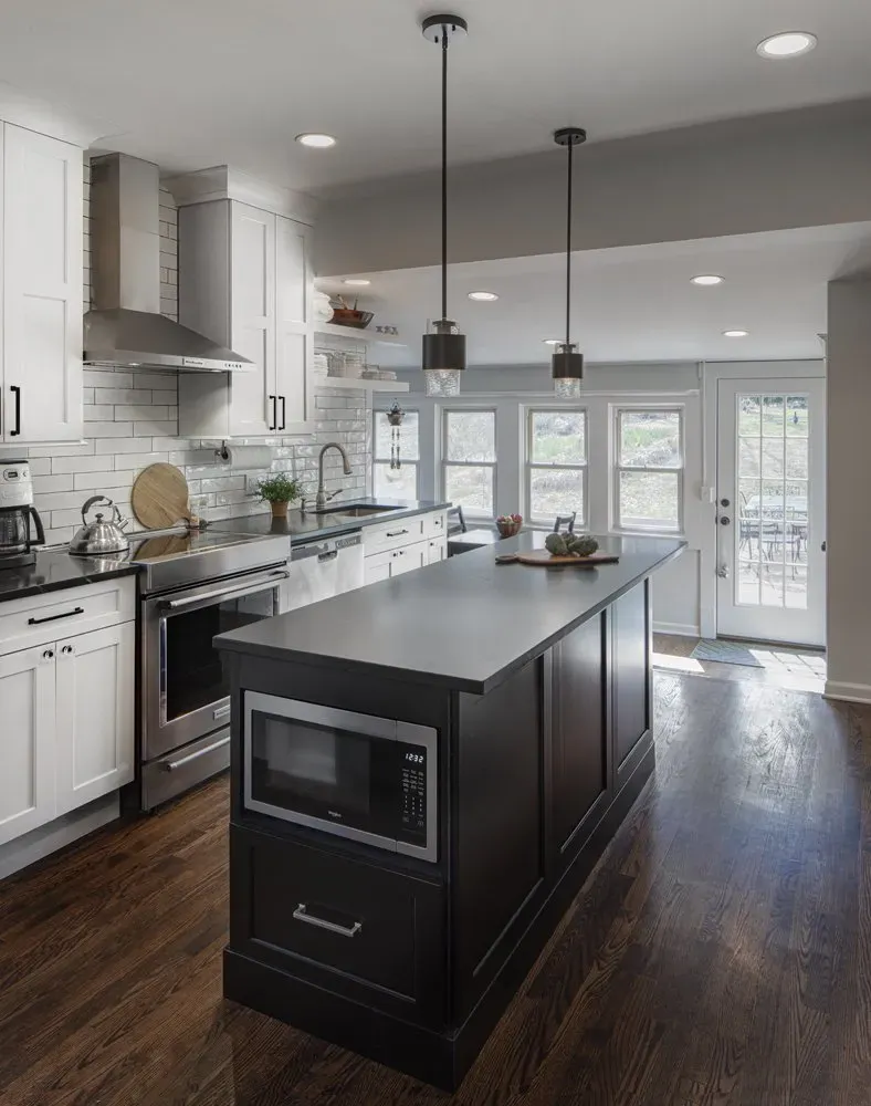 Black countertop with microwave | St. Louis, MO | Perspective Cabinetry & Design