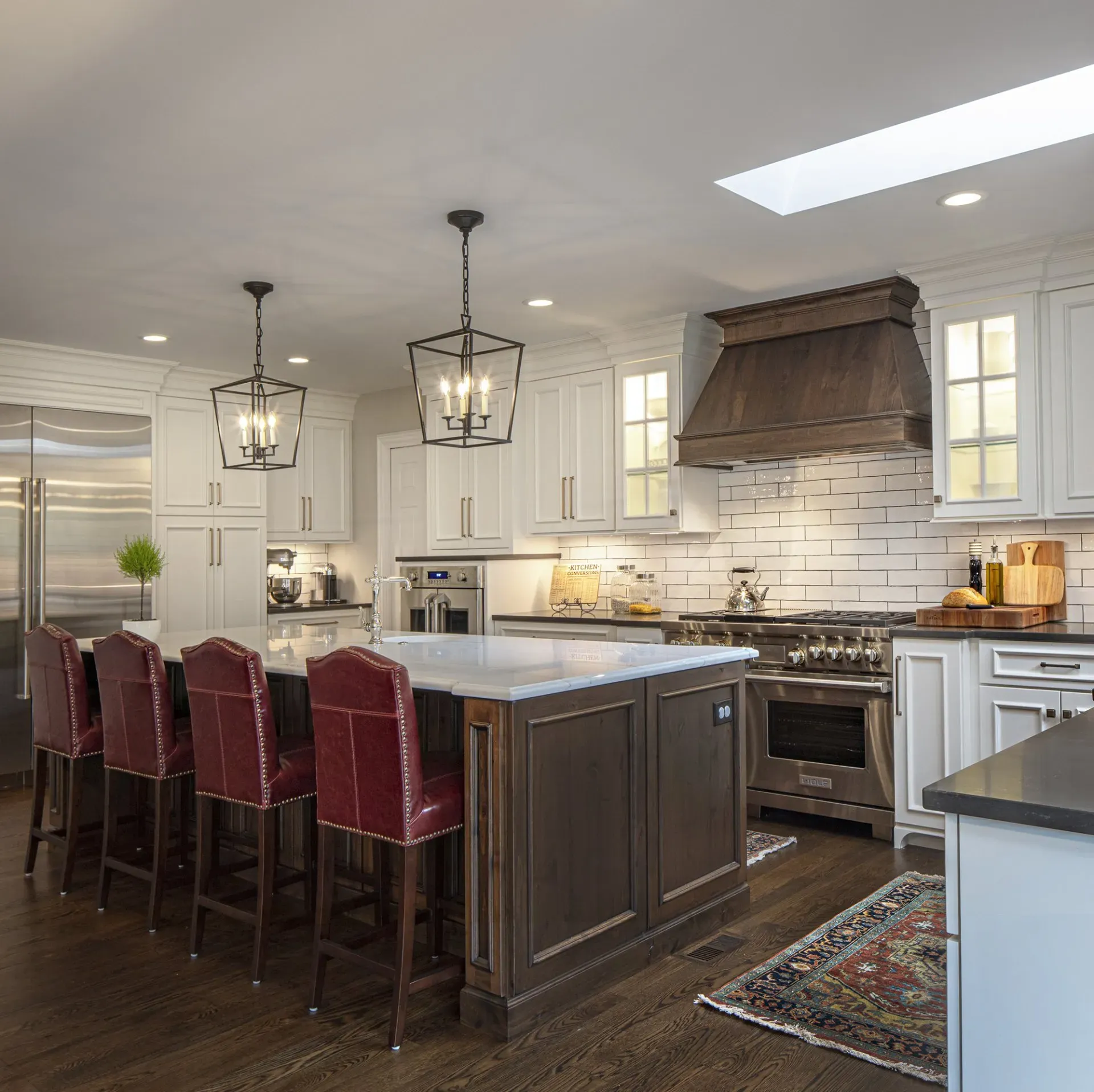 Kitchen with red chair | St. Louis, MO | Perspective Cabinetry & Design
