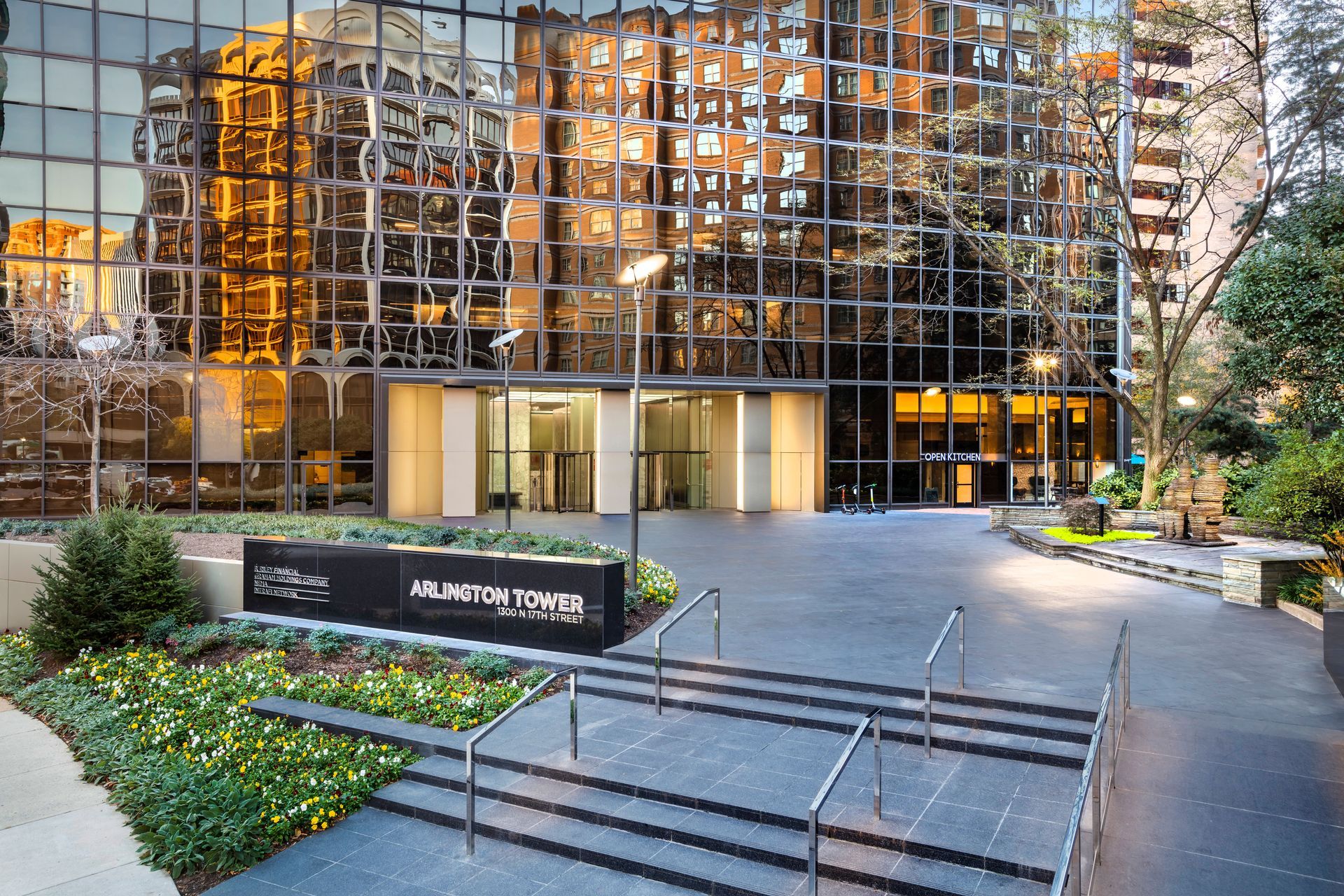 A large building with stairs and a sign that says atrium tower