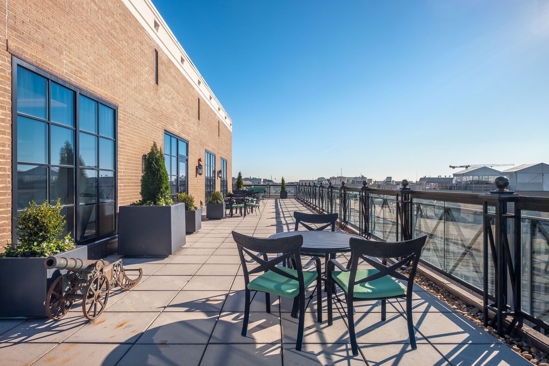 There is a patio with a table and chairs on it.