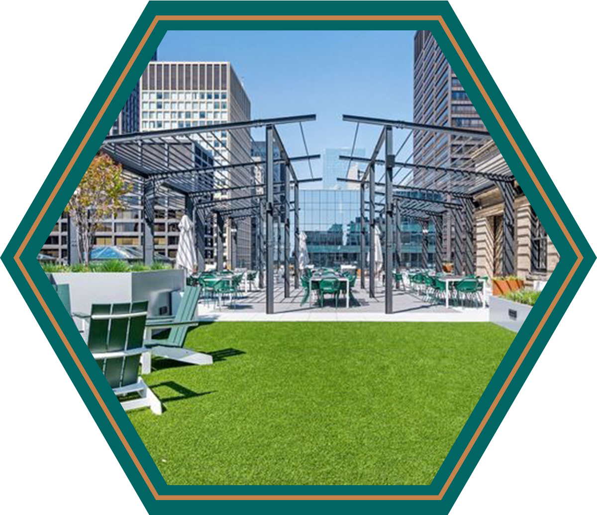 A picture of a rooftop patio with chairs and tables
