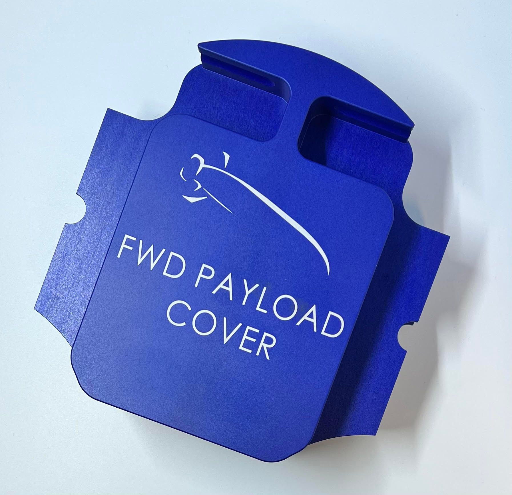 A blue fwd payload cover sits on a white surface