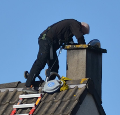 guy cleaning chimney