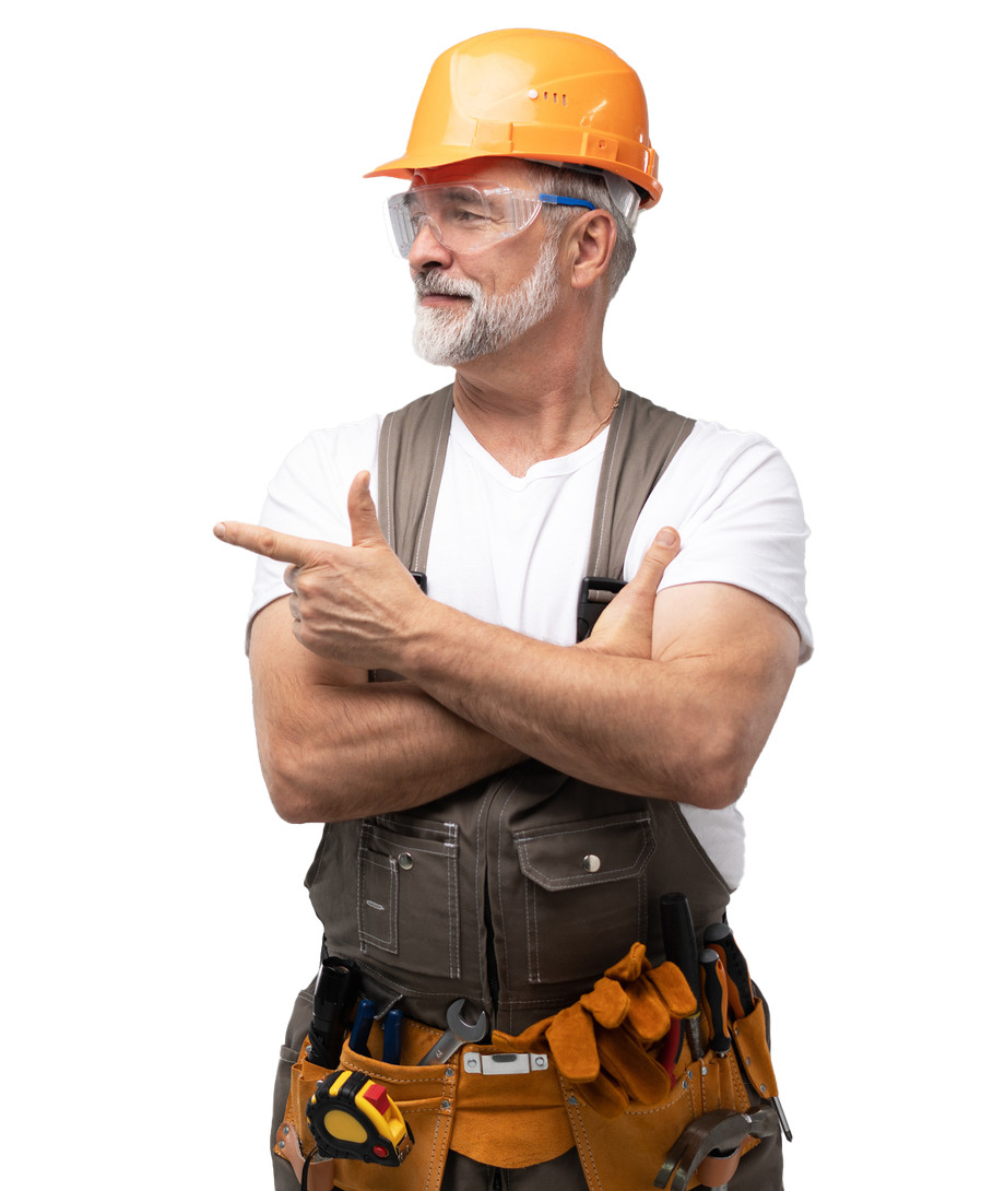 Construction worker with orange helmet and safety glasses, pointing left, looking right.