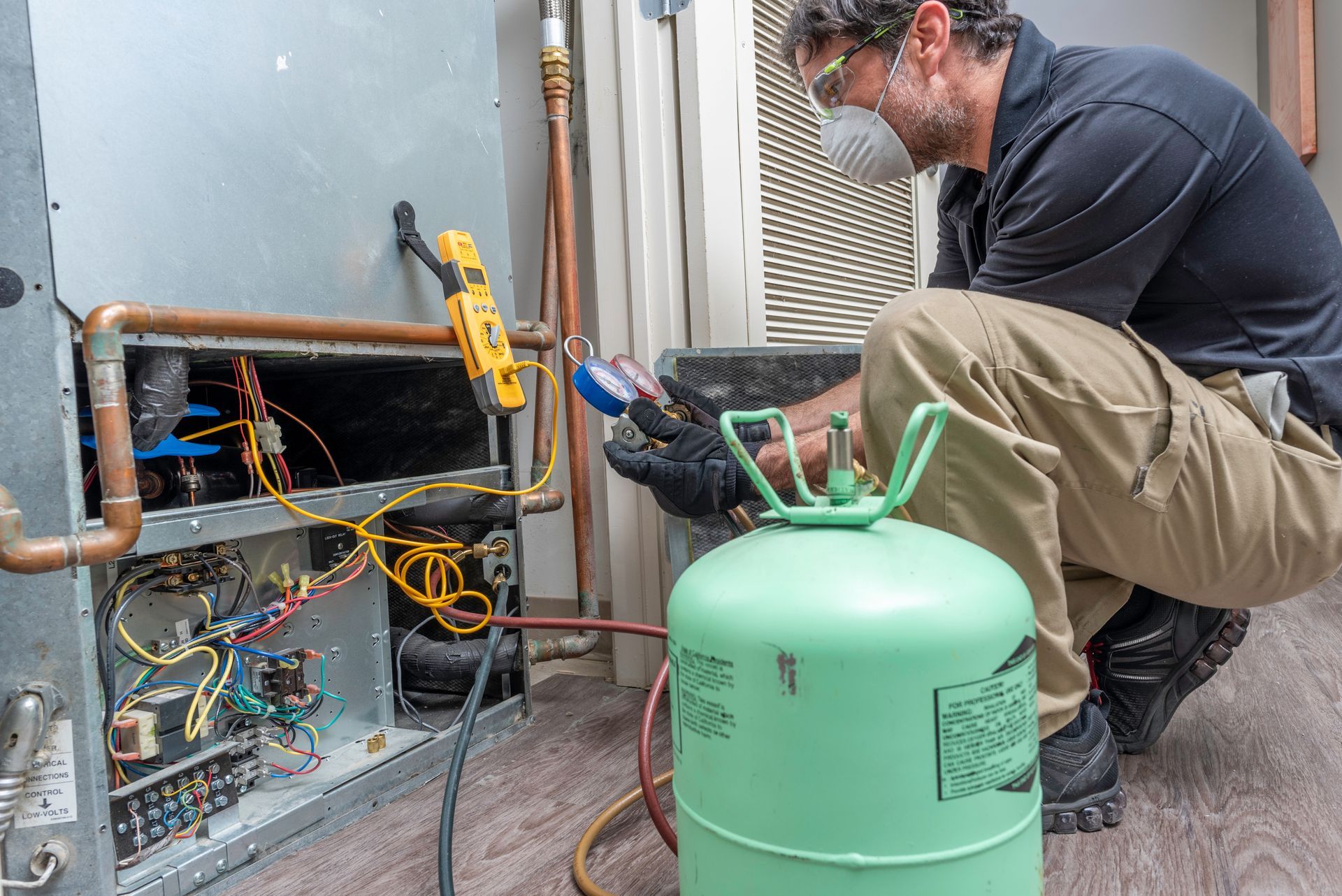 Technician repair a commercial HVAC system