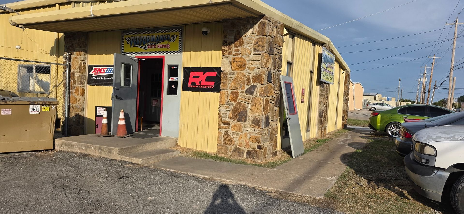 CS Remodeling crew replacing a metal door at a Tulsa commercial building