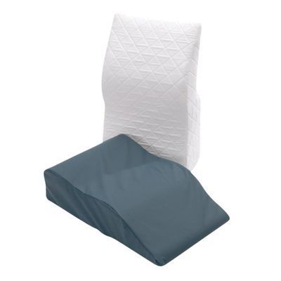 A White Pillow and a Blue Wedge Pillow on a White Background — Coast 2 Coast Disability Support Services in Taree, NSW