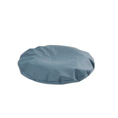 A Blue Round Pillow is Sitting on a White Surface — Coast 2 Coast Disability Support Services in Taree, NSW