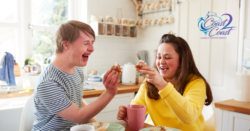 A Man and A Woman Are Eating Food — Coast 2 Coast Disability Support Services in Taree, NSW