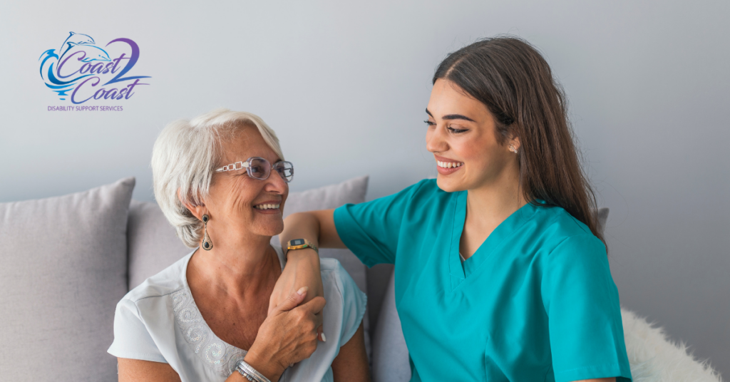 A Nurse Is Talking to An Elderly Woman on A Couch — Coast 2 Coast Disability Support Services in Taree, NSW