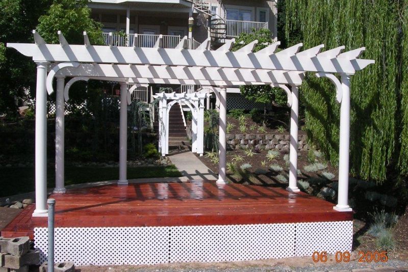pergola in backyard painted white
