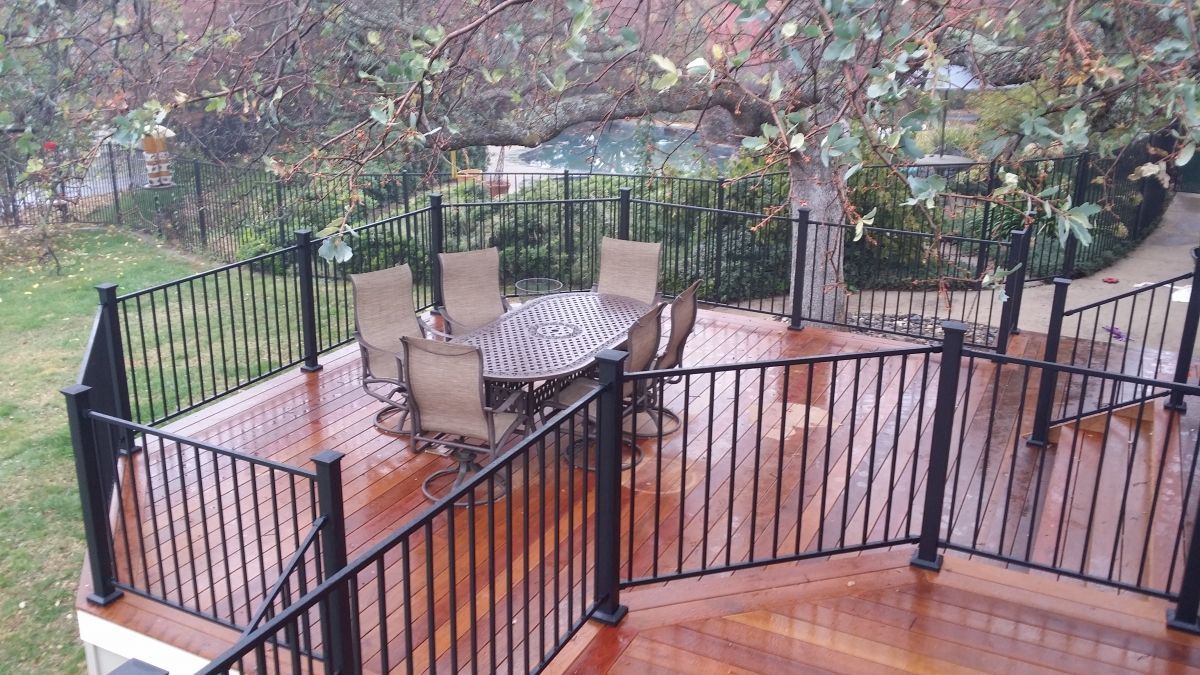 new wood deck installation for outdoor dining area