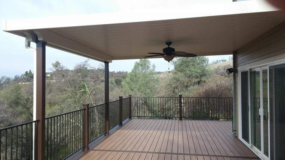 back wood deck installation with railings